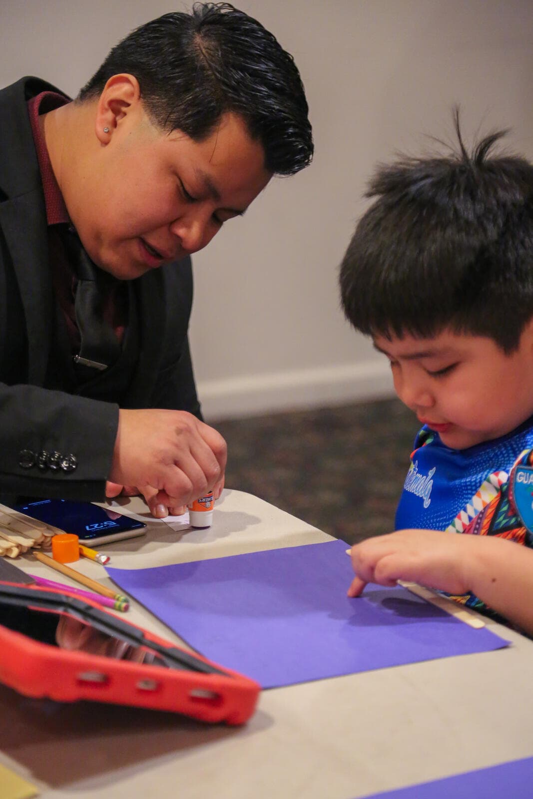 Adult and child doing crafts together
