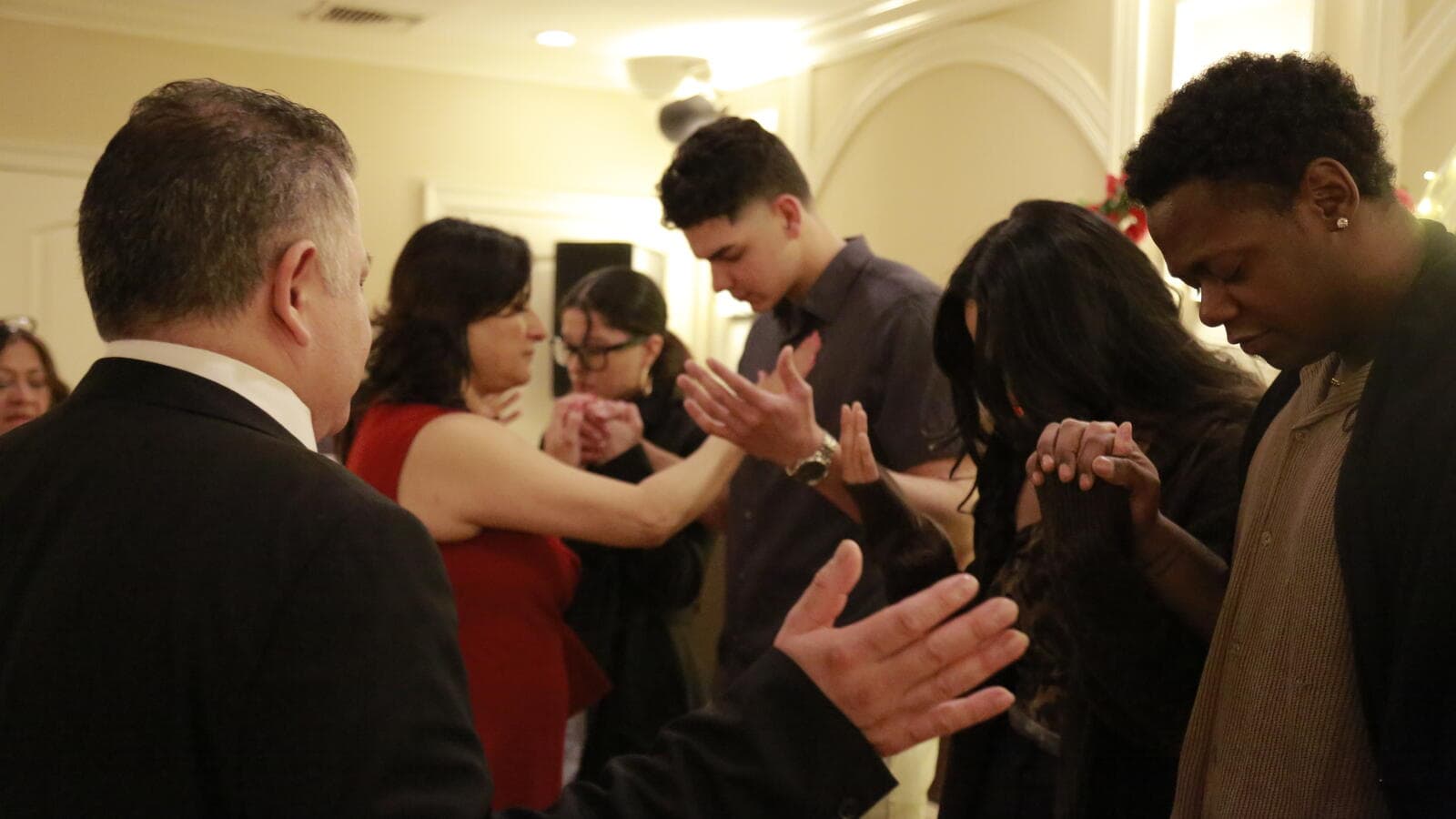 Couples praying together at marriage ministry